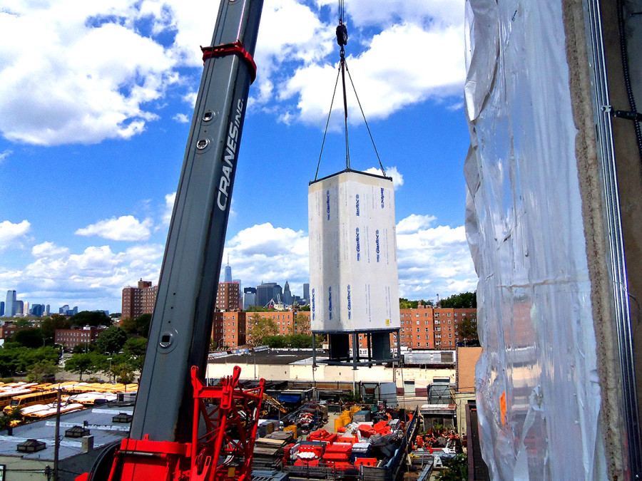 Seven stop elevator getting craned into place