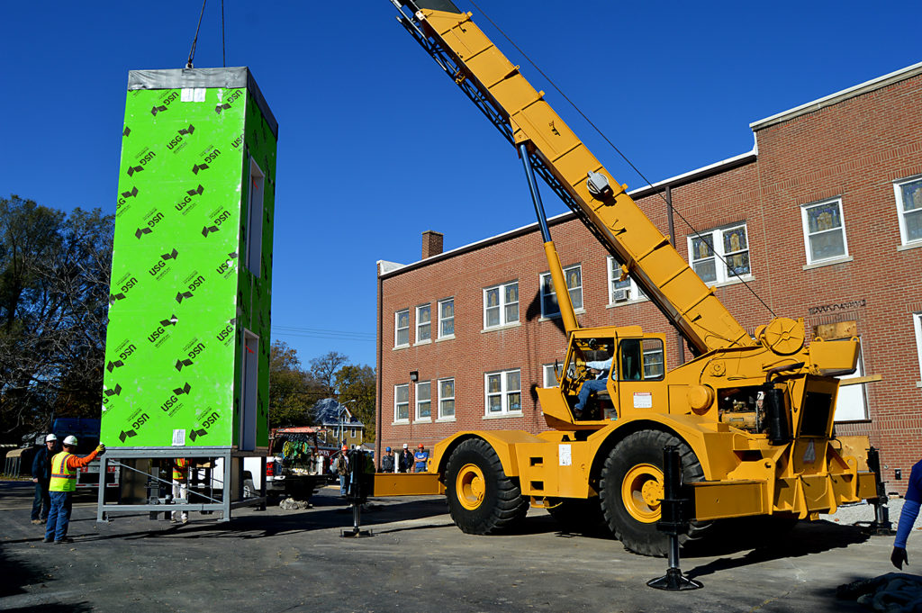 modular prefab elevator installed by crane